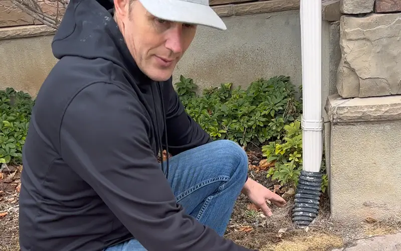 preparing to clean underground gutter drain