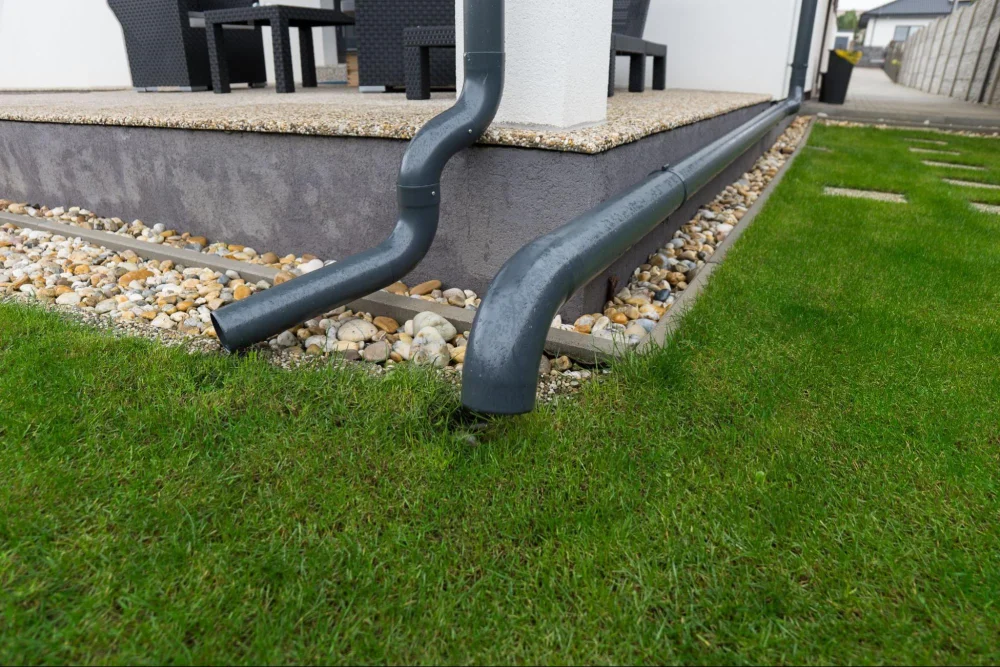 Modern underground downspout drainage enhancing yard appearance